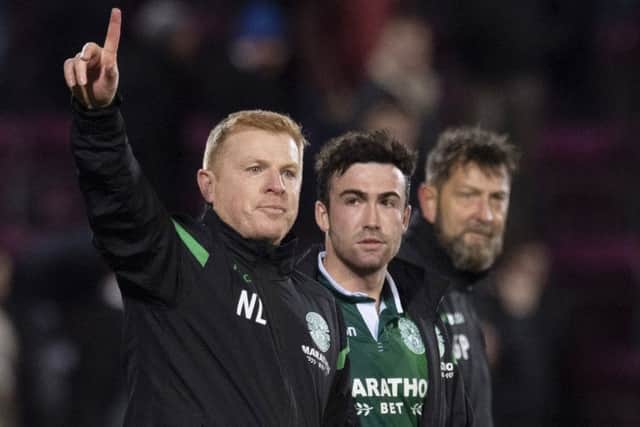 Neil Lennon, with Stephen Mallan, acknowledges the travelling fans. Pic: SNS
