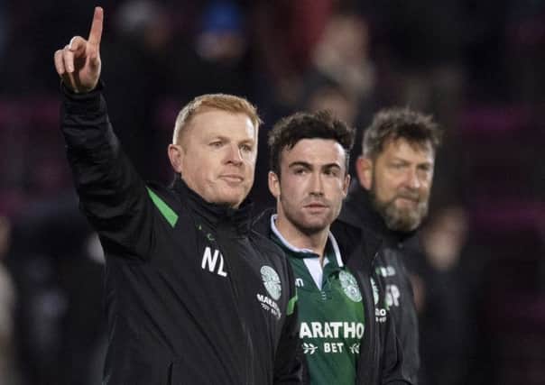 Neil Lennon, with Stephen Mallan, acknowledges the travelling fans. Pic: SNS