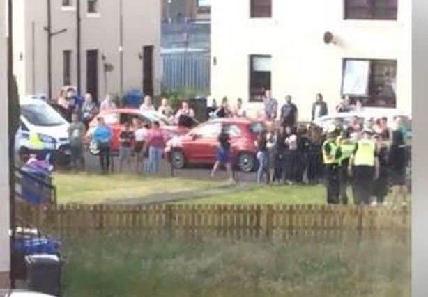 The mob tried to storm Long's house before setting fire to a car outside his home. Picture: Contributed