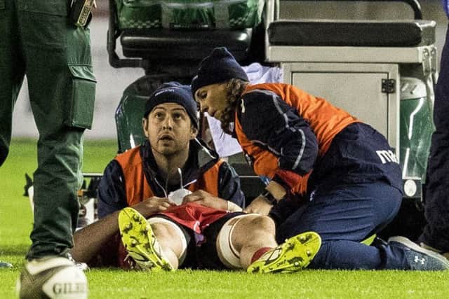 Blade Thomson receives treatment before being stretched off