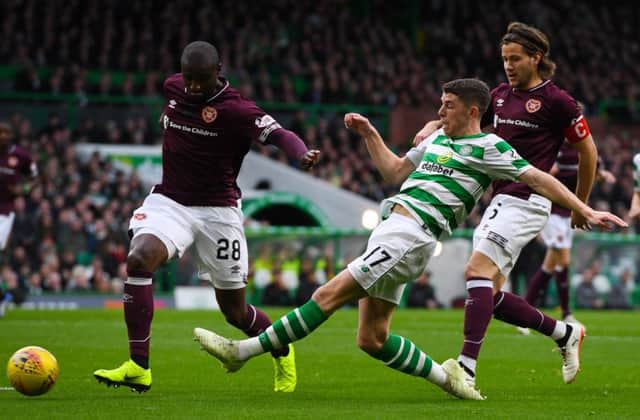 Ryan Christie goes for goal with Clevid Dikamona and Peter Haring in close attention. Picture: SNS