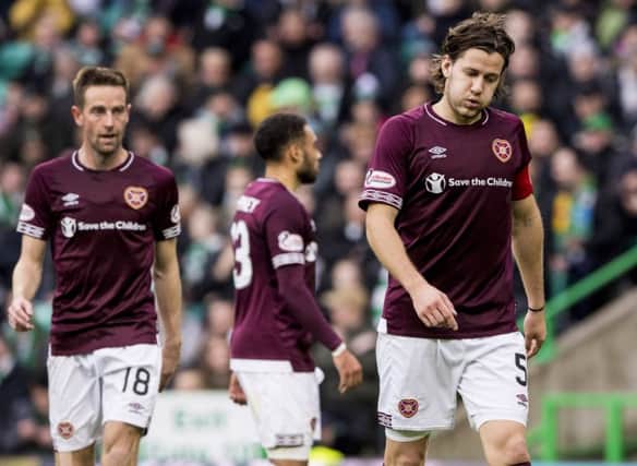 Hearts' Peter Haring looks dejected during the one-sided match at Celtic Park. Picture: SNS