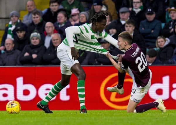 Harry Cochrane battles with Celtic's Dedryck Boyata