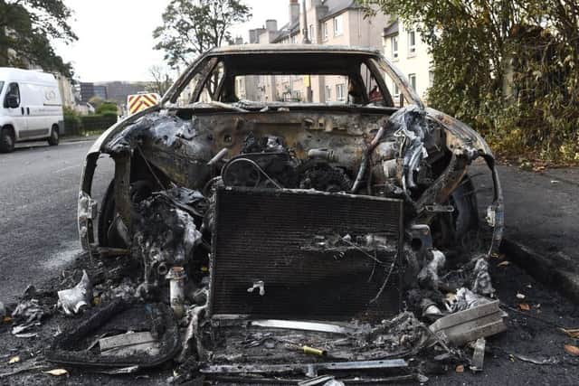 A burnt-out car left in the wake of the trouble that got out of hand. Picture: Lisa Ferguson