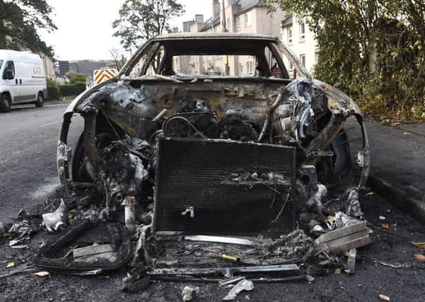 A burnt-out car left in the wake of the trouble that got out of hand. Picture: Lisa Ferguson