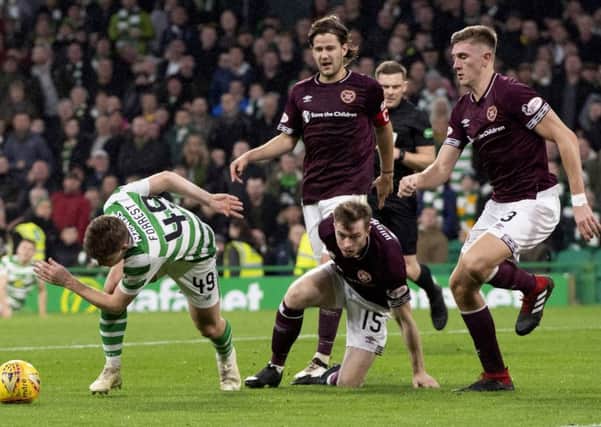 Jimmy Dunne, right, again looked the part despite Hearts' heavy defeat to Celtic