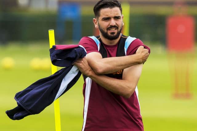 Alim Ozturk says the English third tier is a higher standard than Scotland's top-flight. Picture: SNS/Gary Hutchison