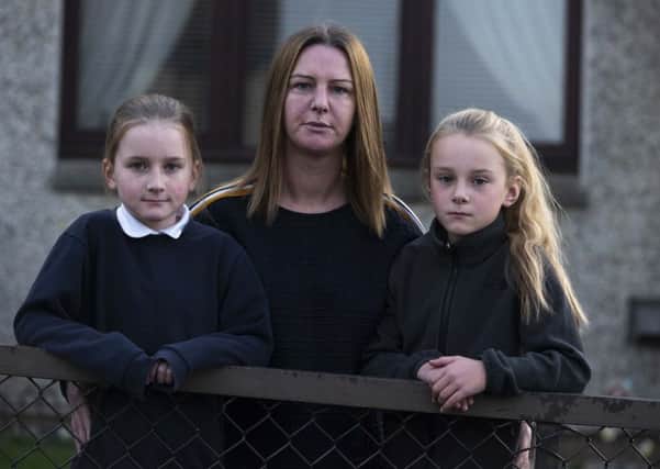Daisy Showler, 9, from Gorbridge who is moving school after four years of complaining about bullying. Pictured with her mother Lynsey Showler and her twin sister Millie