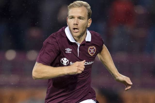 Martin signed a three-and-a-half year deal with Hearts