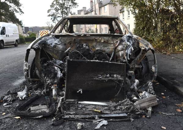 A burnt-out car in Craigentinny last year following carnage on Bonfire Night. Picture: Lisa Ferguson