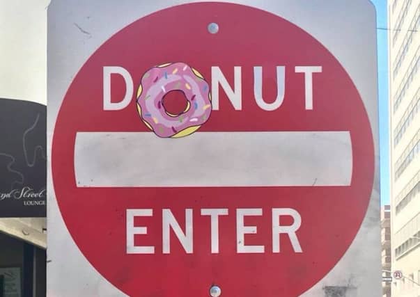 Clet Abraham has altered street signs around the world. Picture: Facebook