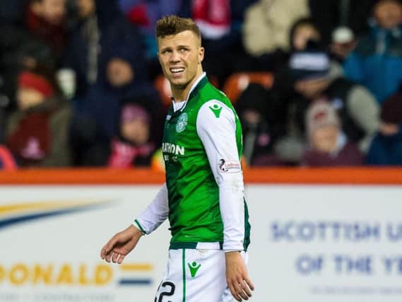 Florian Kamberi cuts a dejected figure as Hibs lost out 1-0 to Aberdeen at Pittodrie. Pic: SNS