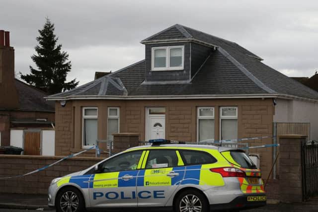Police outside Teresa McCann's home in Captain's Road where she was the victim of an acid attack. Picture: Andrew Milligan/PA Wire