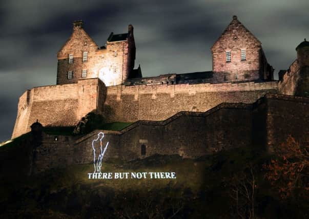 A silhouette of a First World War Tommy projected on to Edinburgh Castle. Picture: PA Wire