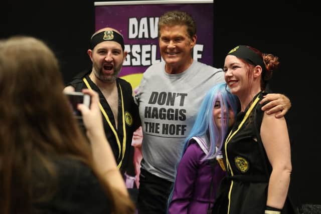 David Hasselhoff poses for photographs with cosplayers during the FOR THE LOVE OF 80s -Comic Con Scotland event at the EICC. Picture: PA Wire