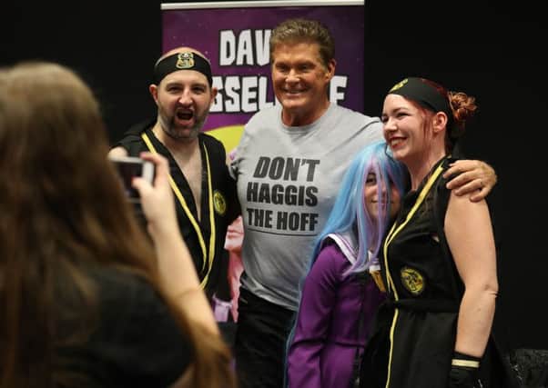 David Hasselhoff poses for photographs with cosplayers during the FOR THE LOVE OF 80s -Comic Con Scotland event at the EICC. Picture: PA Wire