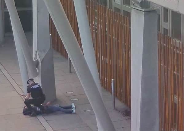 A police officer has spoken of his fear as he raced to tackle a knife-wielding thug who tried to set fire to the Scottish Parliament.