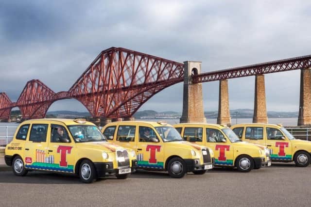 The Tennent's taxis by the Forth Rail Bridge. Pic: supplied by PR