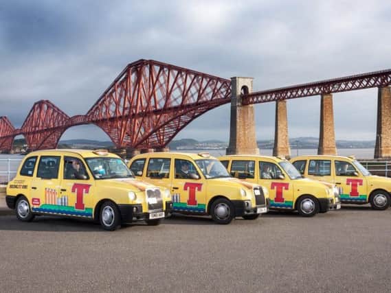 The Tennent's taxis by the Forth Rail Bridge. Pic: supplied by PR