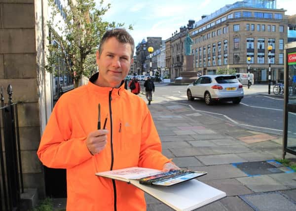 Andy Glidden sketching on the streets of the Capital.