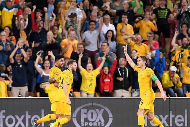 Martin Boyle and Mark Milligan congratulate Massimo Luongo on his goal. Picture: Getty Images