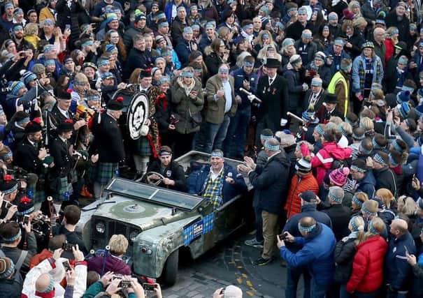 Former Scotland rugby international Doddie Weir is driven to Murrayfield stadium after hosting 'The Gathering of 10,000 Headbands' at Edinburgh's Mercat Cross, a fundraising event to support the My Name'5 Doddie Foundation. Picture: Jane Barlow/PA Wire