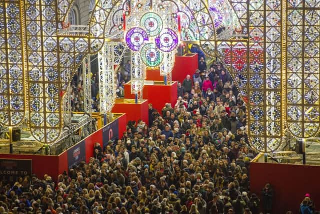 Thousands flocked to George Street to take in the dazzling Christmas light display. Picture: Ian Rutherford