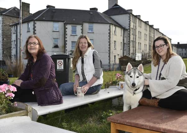 Delena Rudkin and Clare Devlin of the Piershill Back Green Association with resident Brooklyn Robertson. Picture: TSPL