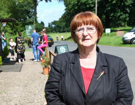 Cllr Margot Russell who has has been unsuccessful in her bid to persuade the duke of buccleuch to allow Dalkeith residents into Dalkeith Country Park for free.
Margo is pictured at the entrance to the park.