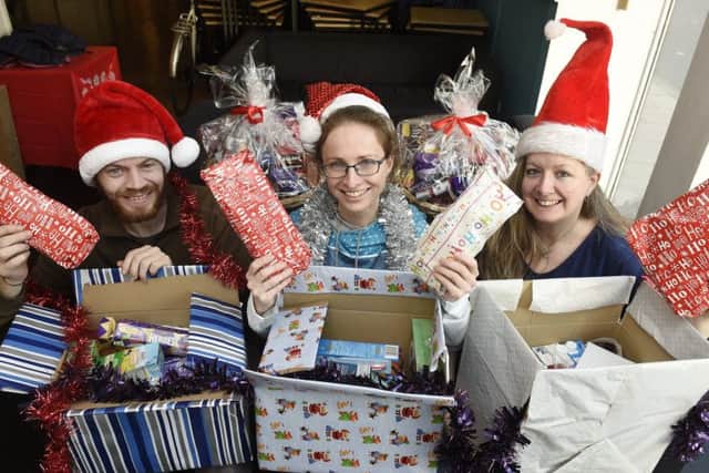 Graeme Coleman, Liz Bowes and Natalie Morgan of Destiny Angels are creating festive hampers for those who need it most in Edinburgh.