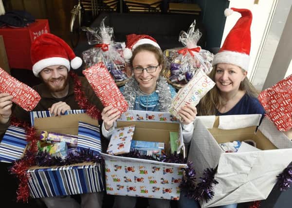 Graeme Coleman, Liz Bowes and Natalie Morgan of Destiny Angels are creating festive hampers for those who need it most in Edinburgh.