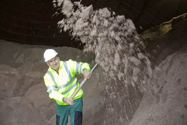 Edinburgh Council's preparation for winter -
Fraser Stewart, a depot roadman, shovelling road salt