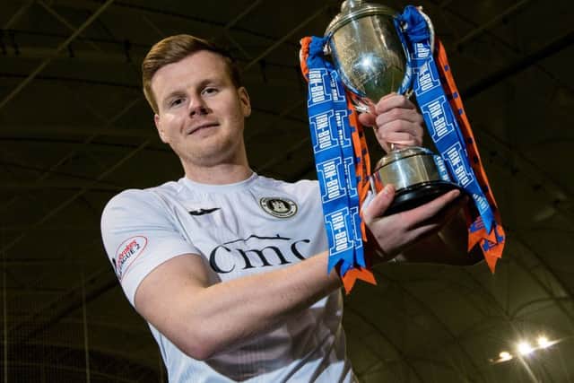 Blair Henderson, who scored against Alloa, with the Irn-Bru Cup. Picture: SNS Group