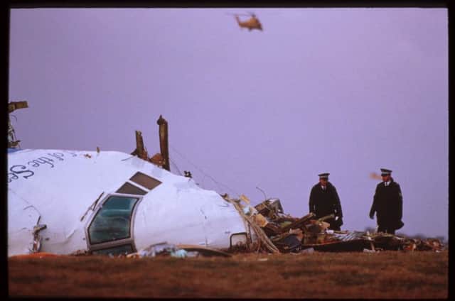 Officials inspect the wreckage of Pan Am flight 103 December 21, 1988 in Lockerbie. (Photo by George DeKeerle/Getty Images)