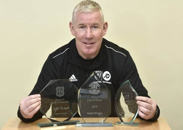 Keith Wright with his three Hall of Fame awards from  Dundee, Hibs and Raith Rovers.  Picture: Neil Hanna