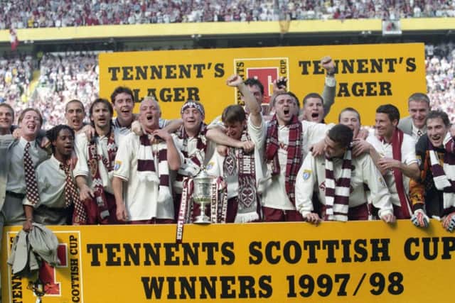 Hearts players celebrate winning the 1998 Scottish Cup, beating Rangers in the final