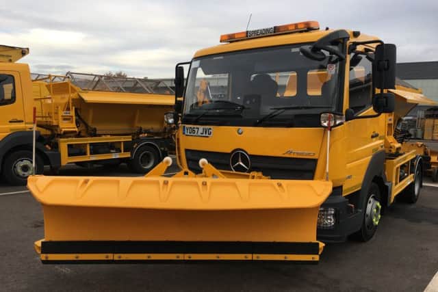 A gritter on the road
