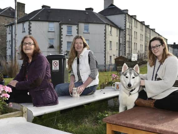 Delena Rudkin and Clare Devlin of the Piershill Back Green Association with resident Brooklyn Robertson. Picture: TSPL.