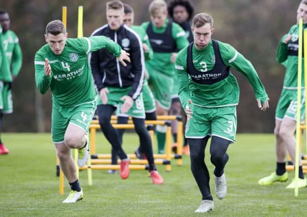 Steven Whittaker, right, prepares for this afternoons match against Dundee alongside the fit-again Paul Hanlon. Pic: SNS