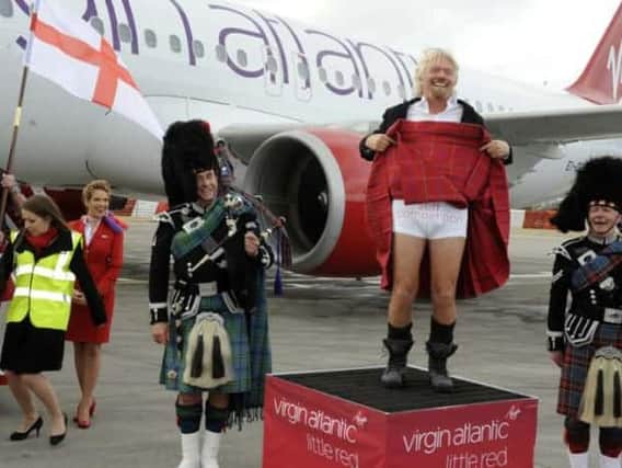 Sir Richard Branson's "Stiff Competition" stunt at the launch of Virgin Atlantic's Little Red flights from Edinburgh in 2012. Picture: Julie Bull