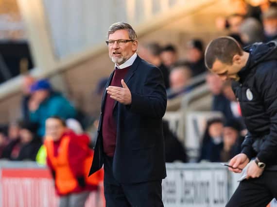 Craig Levein issues instructions from his technical area.