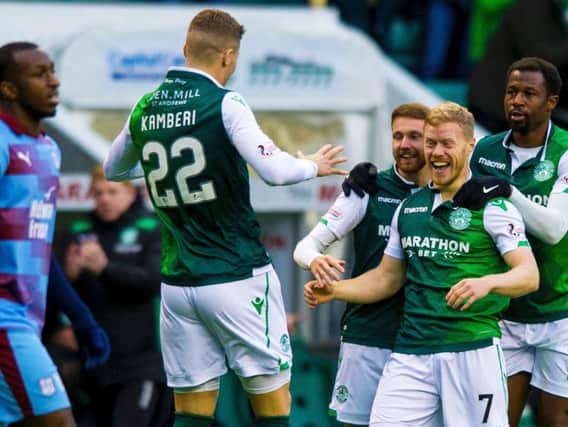 The Hibs players celebrate opening the scoring against Dundee. Pic: SNS