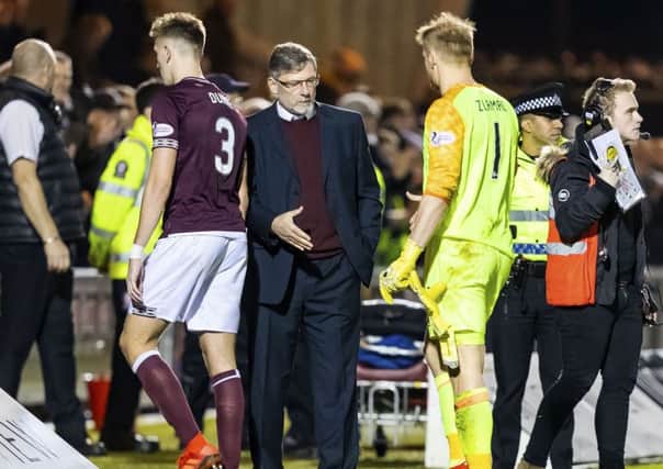 Hearts' Jimmy Dunne and Zdenek Zlamal trudge past manager Craig Levein after the defeat by St Mirren. Pic: SNS