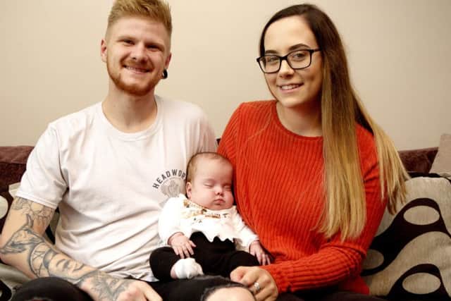Georgia Axford, 19, and Tyler Kelly, 21, with baby Piper-Koh. Picture: SWNS
