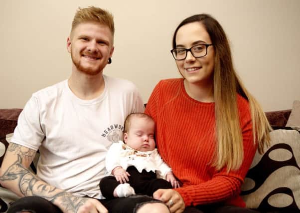Georgia Axford, 19, and Tyler Kelly, 21, with baby Piper-Koh.  Picture: SWNS