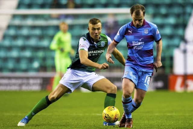 Hibs defender Ryan Porteous challenges Dundee's Paul McGowan during the 2-2 draw at Easter Road. Pic: SNS