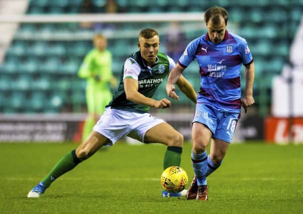 Hibs defender Ryan Porteous challenges Dundee's Paul McGowan during the 2-2 draw at Easter Road. Pic: SNS