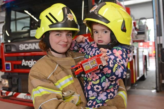 Jessica with her mum Leanne Hamilton pictured at the Toll Cross fire station. Picture: Jon Savage/TSPL