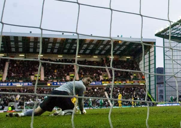 Artur Boruc looks back to see the ball fly into the net at Easter Road