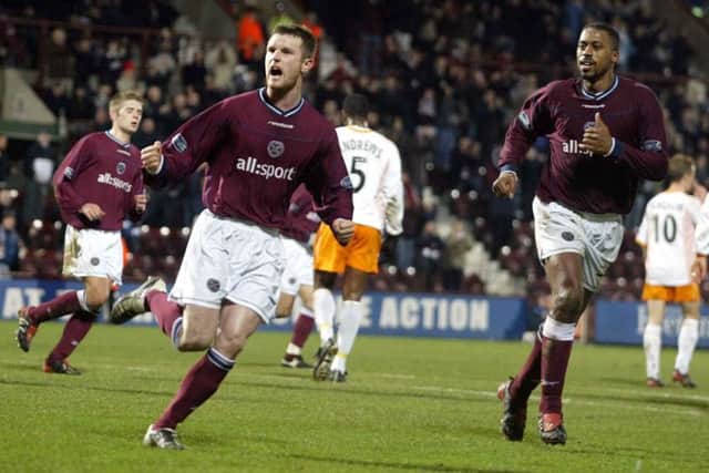 Hearts striker Andy Kirk wheels away in delight after scoring his side's second goal from the spot